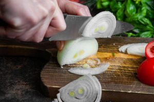 Designed by Freepik- https://www.freepik.com/free-photo/housewife-cutting-onion-salad-wooden-board-close-up_8147623.htm#fromView=search&page=1&position=1&uuid=a7da71c6-f666-4fab-966c-e5b258349593