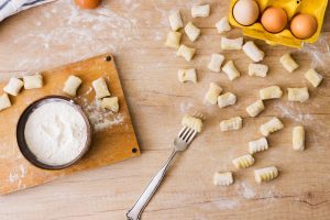 Designed by Freepik - https://www.freepik.com/free-photo/overhead-view-fork-preparing-fresh-italian-pasta-gnocchi-wooden-desk_4200709.htm#fromView=search&page=1&position=12&uuid=2be023fb-8207-474e-bb0b-26b8d1ae3516